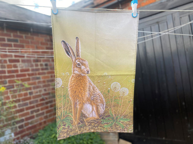 1000-x-750-Hare-and-Dandelion-Clocks-Tea-Towel-Outdoor-Lifestyle